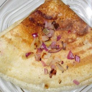 Onion Dosa served with Chutney and Sambar