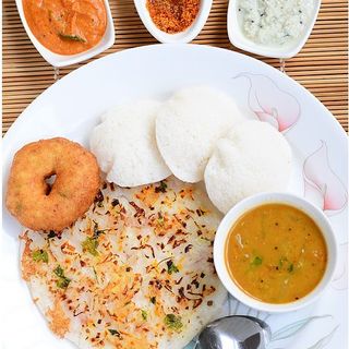 Onion Uthapam, Idli (2) and Vada served with Coconut Chutney, Sambar and Totatto Chutney