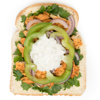 White Bread - Chicken Tikka, Tzatziki, Pepper, Red Onion & Coriander