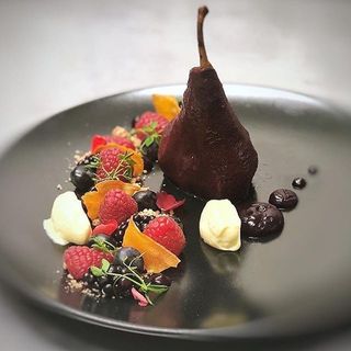 Assiette of poached fruit, red berries vanilla sabayon